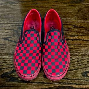 Vans red and black checker slip-ons.